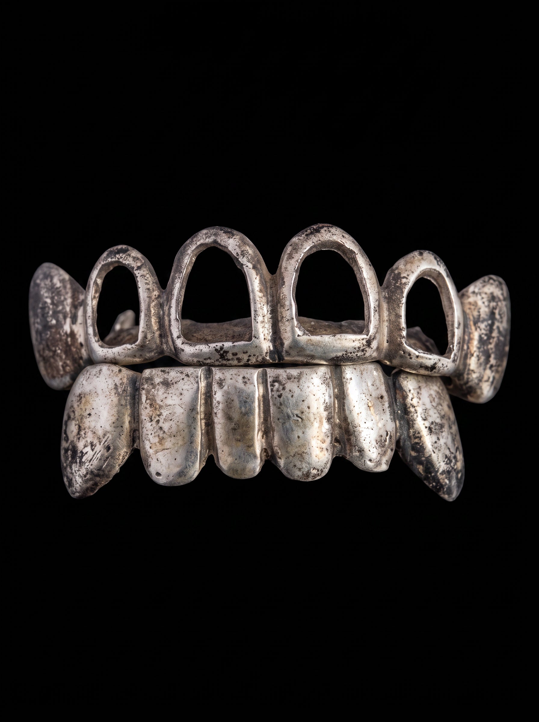 Tarnished grillz before restoration